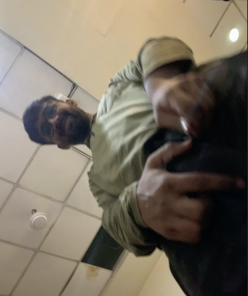 Kumar leaning into the camera with a grin