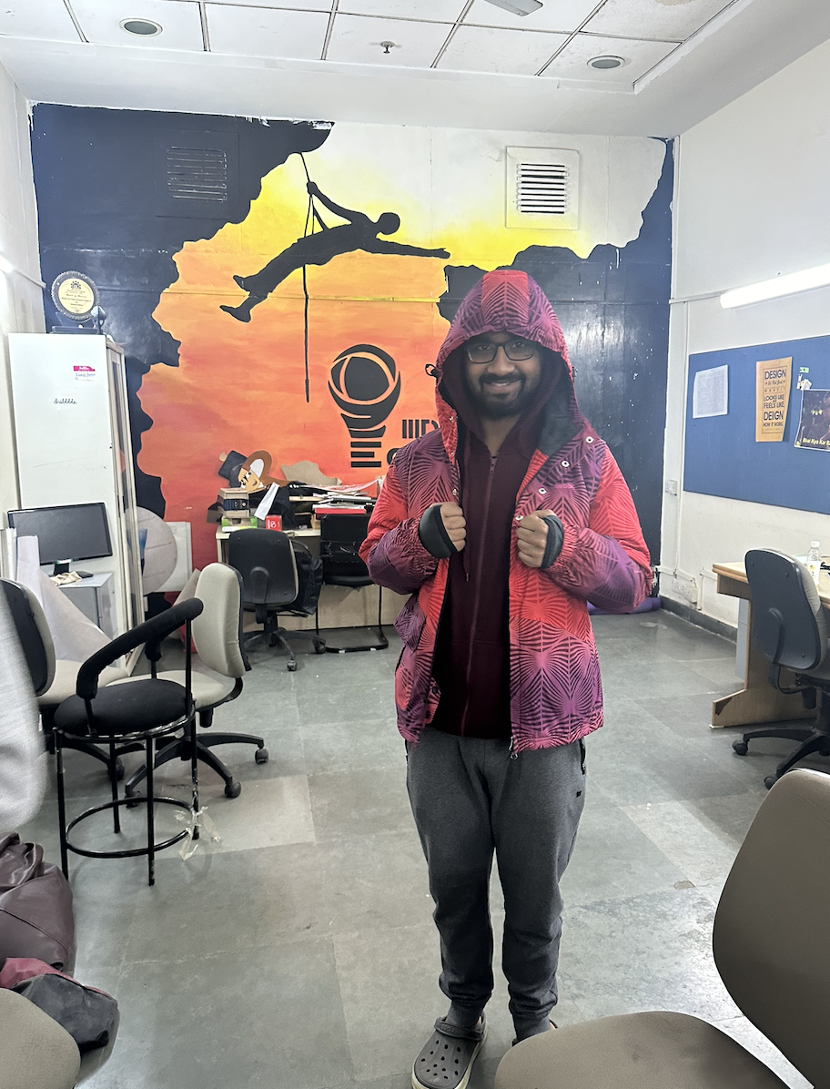 Kumar in a bright pink jacket